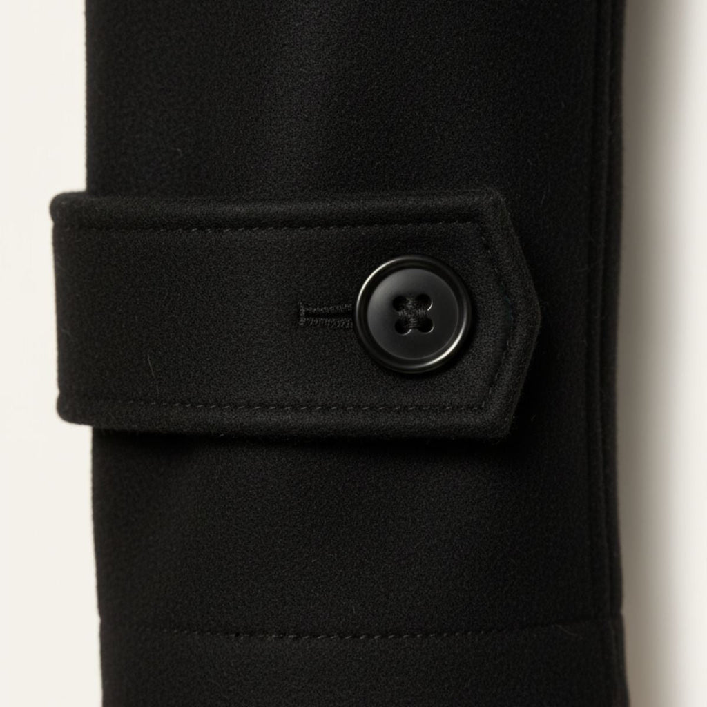 Black wool-blend pea coat cuff with buttoned strap detail