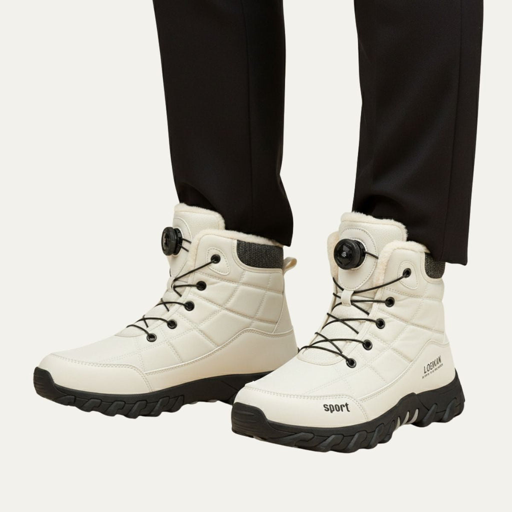 Men's white high-top snow boots worn with dark pants, lace-up and fur trim