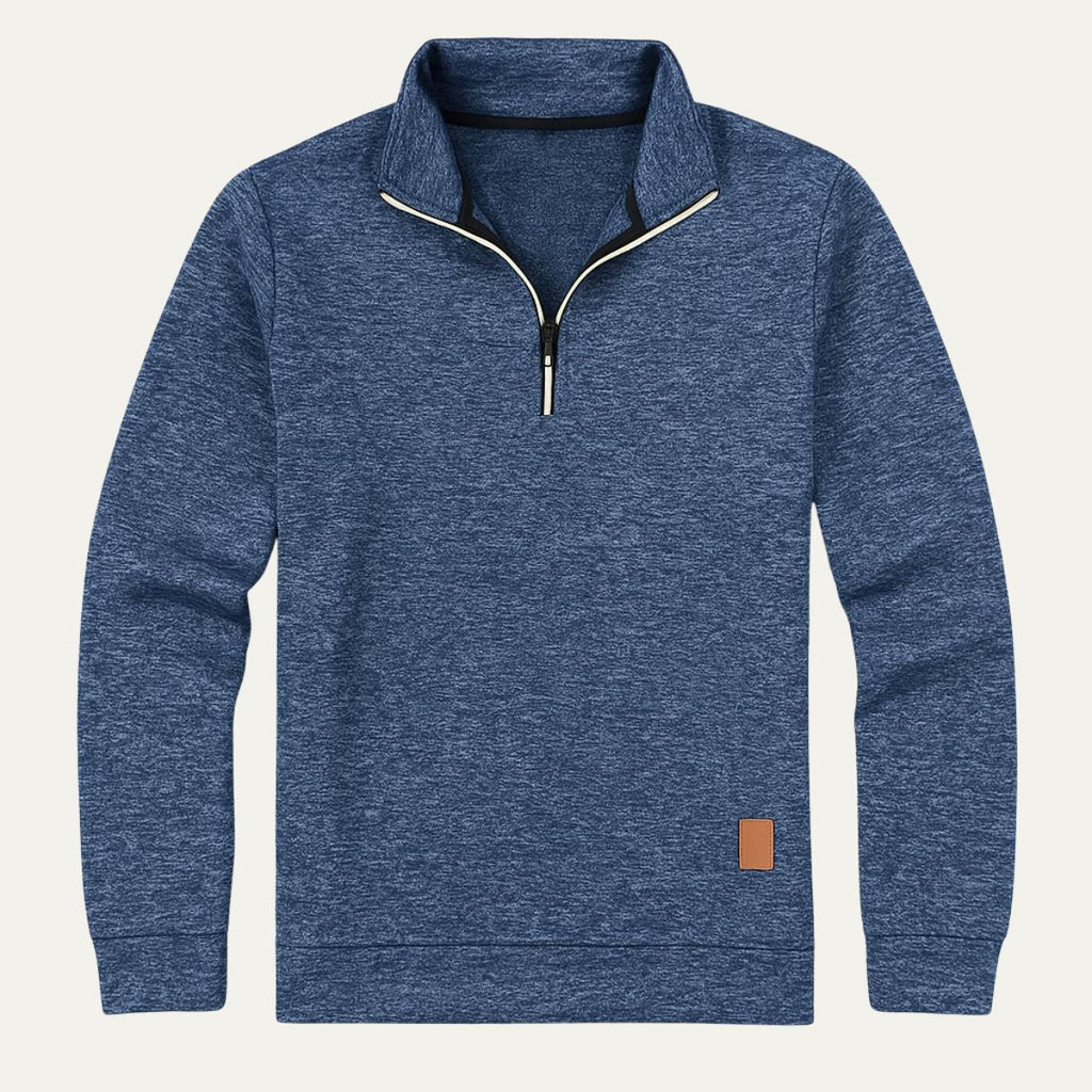 Men's blue heather half-zip fleece pullover with stand collar and long sleeves, tan patch