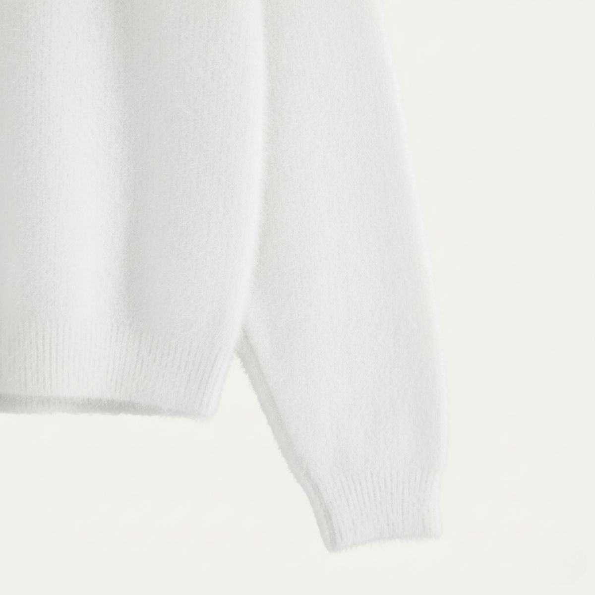 White cashmere sweater sleeve with ribbed cuff