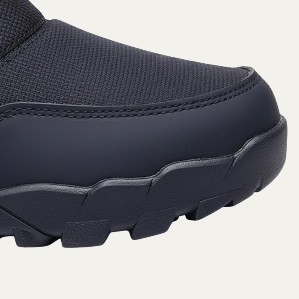 Men's insulated snow boots toe area with stitched trim and thick rubber outsole