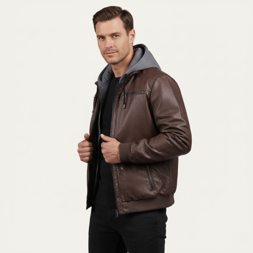 Men's dark brown hooded leather bomber jacket on model with front zip and hood lining