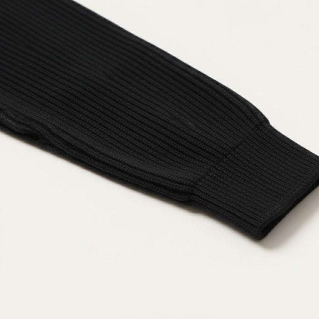 Black ribbed knit sweater sleeve cuff detail
