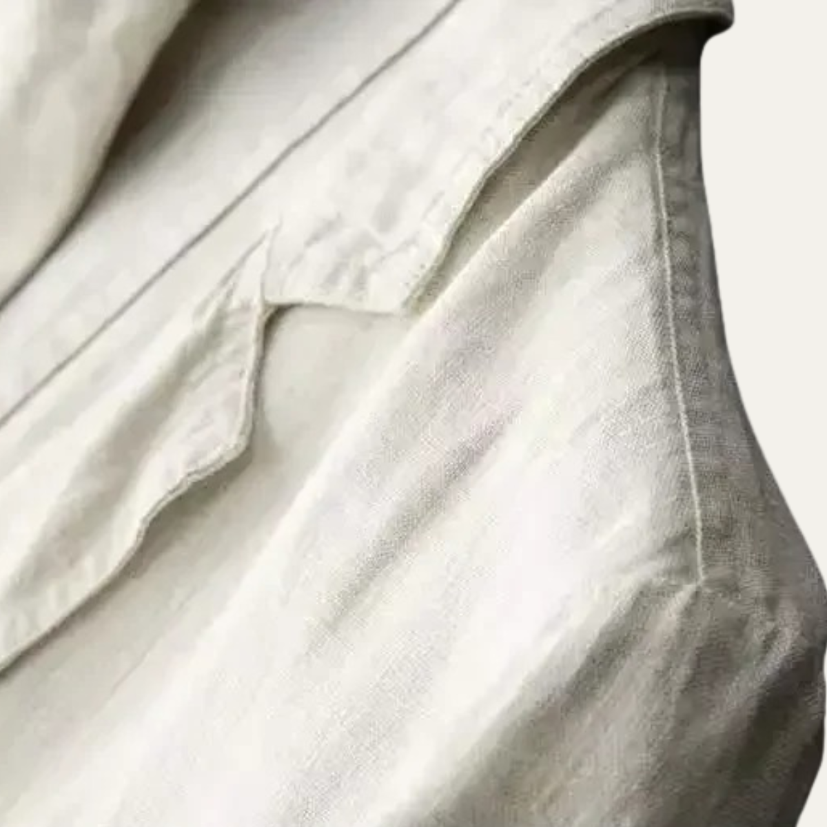 Cotton-linen suit fabric close-up, pale white textured weave