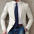 Men's white smart casual blazer worn with navy tie and buttoned jacket front