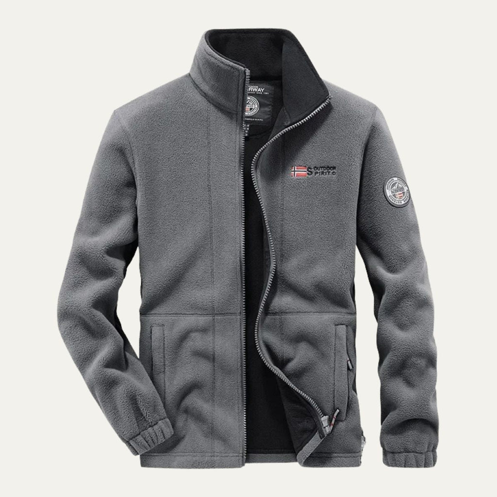 Men's gray fleece-lined outdoor jacket with full-zip front and sleeve patch