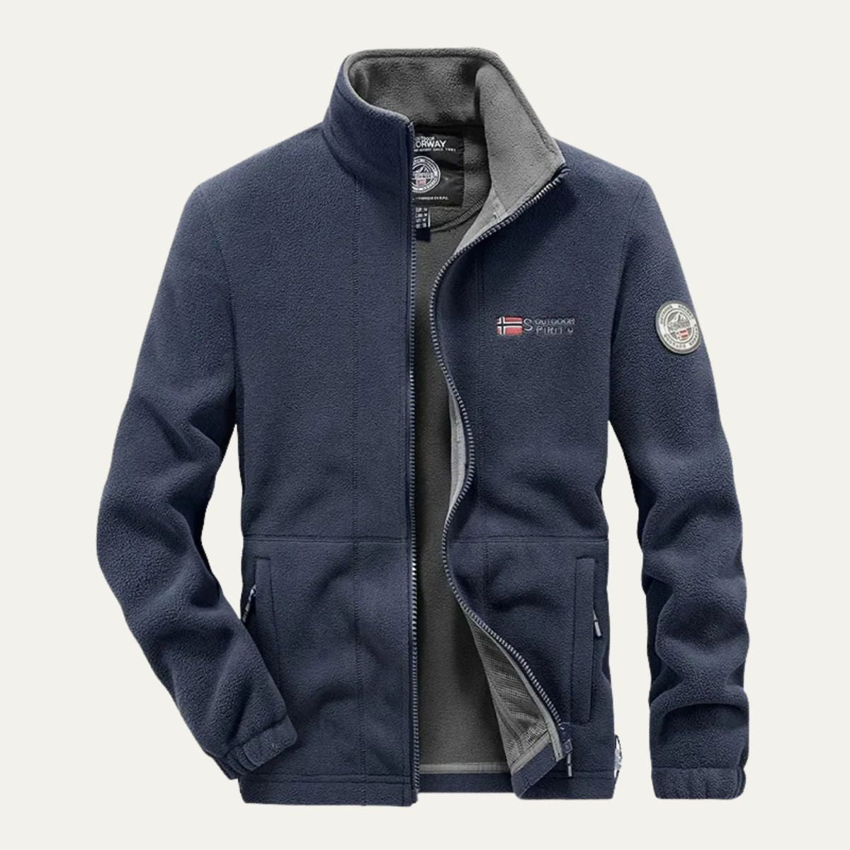 Men's blue fleece-lined outdoor jacket with full-zip, pockets, and logo patches