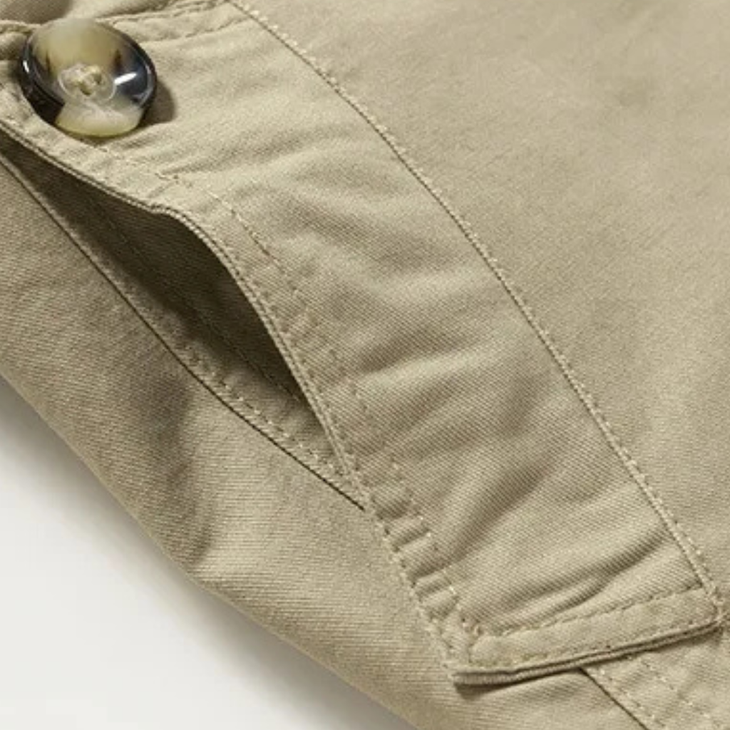 Men's tan trench coat sleeve seam and cuff with buttoned placket