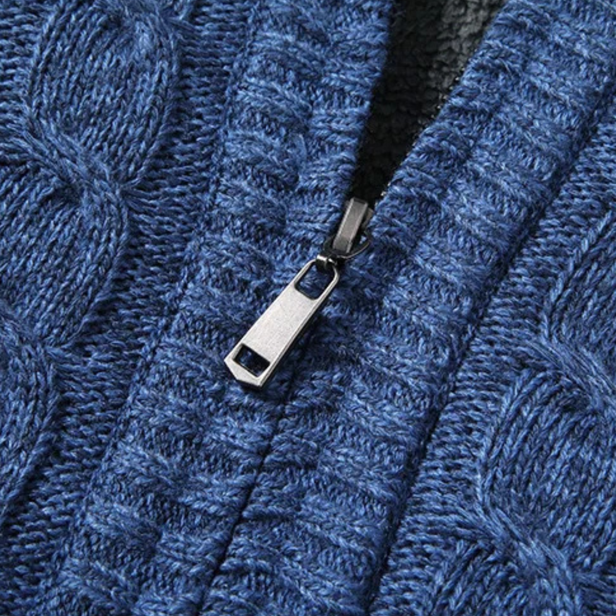 Blue knit cardigan with metal zipper pull and front zip opening detail