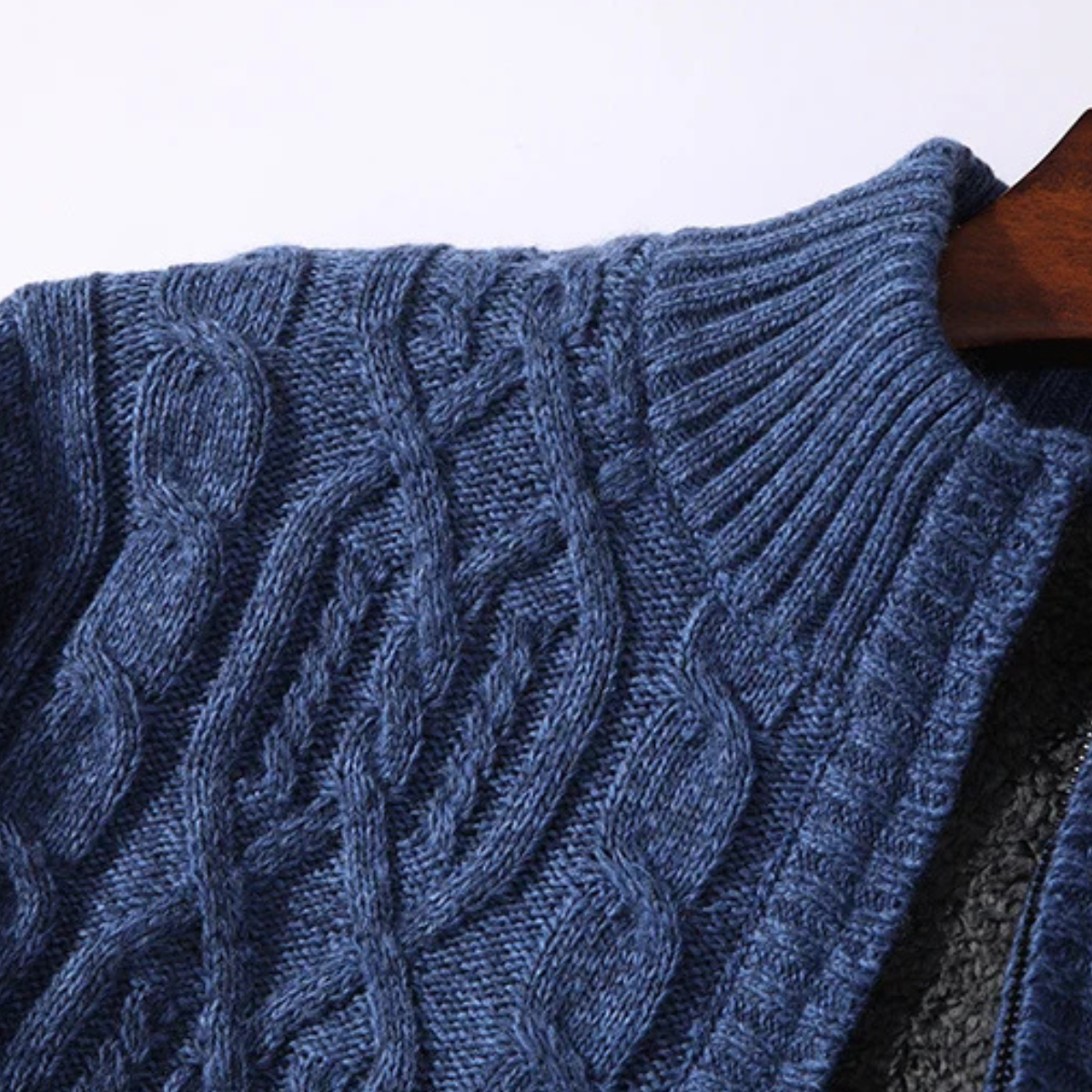 Blue cable-knit cardigan knit texture on stand collar and shoulder area