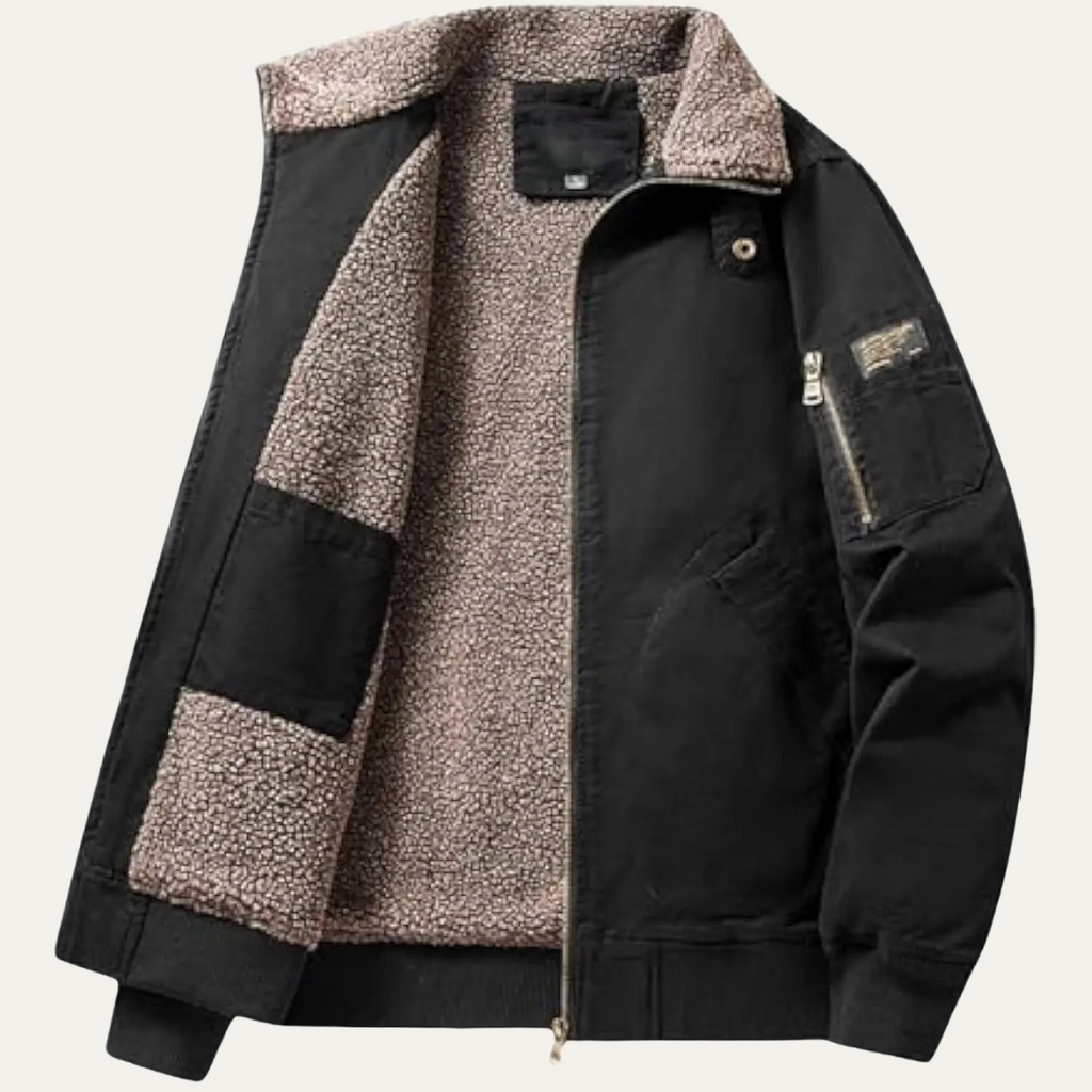 Black bomber jacket with tan shearling lining, stand collar, and zip front