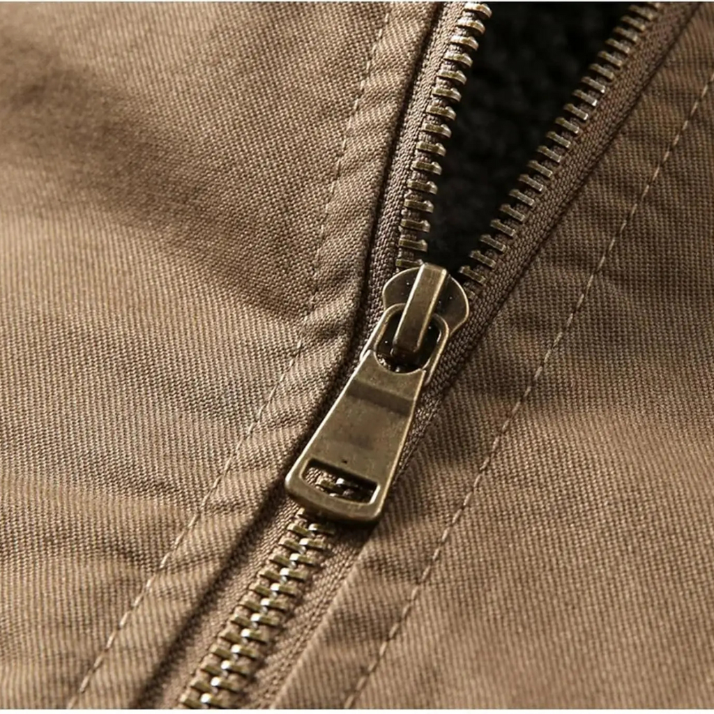 Brown quilted shearling bomber zipper with metal pull and stitched panel