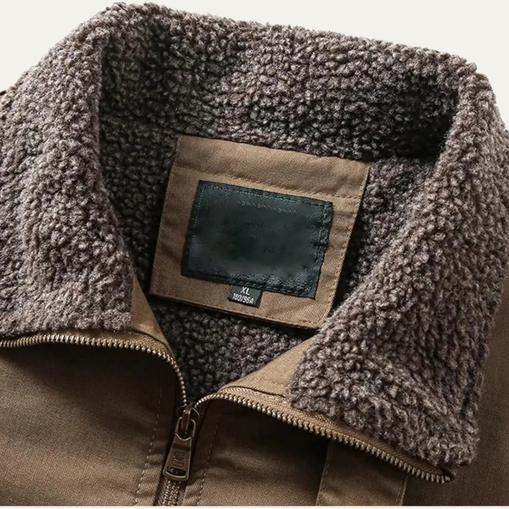 Taupe shearling-lined bomber jacket collar with interior size label