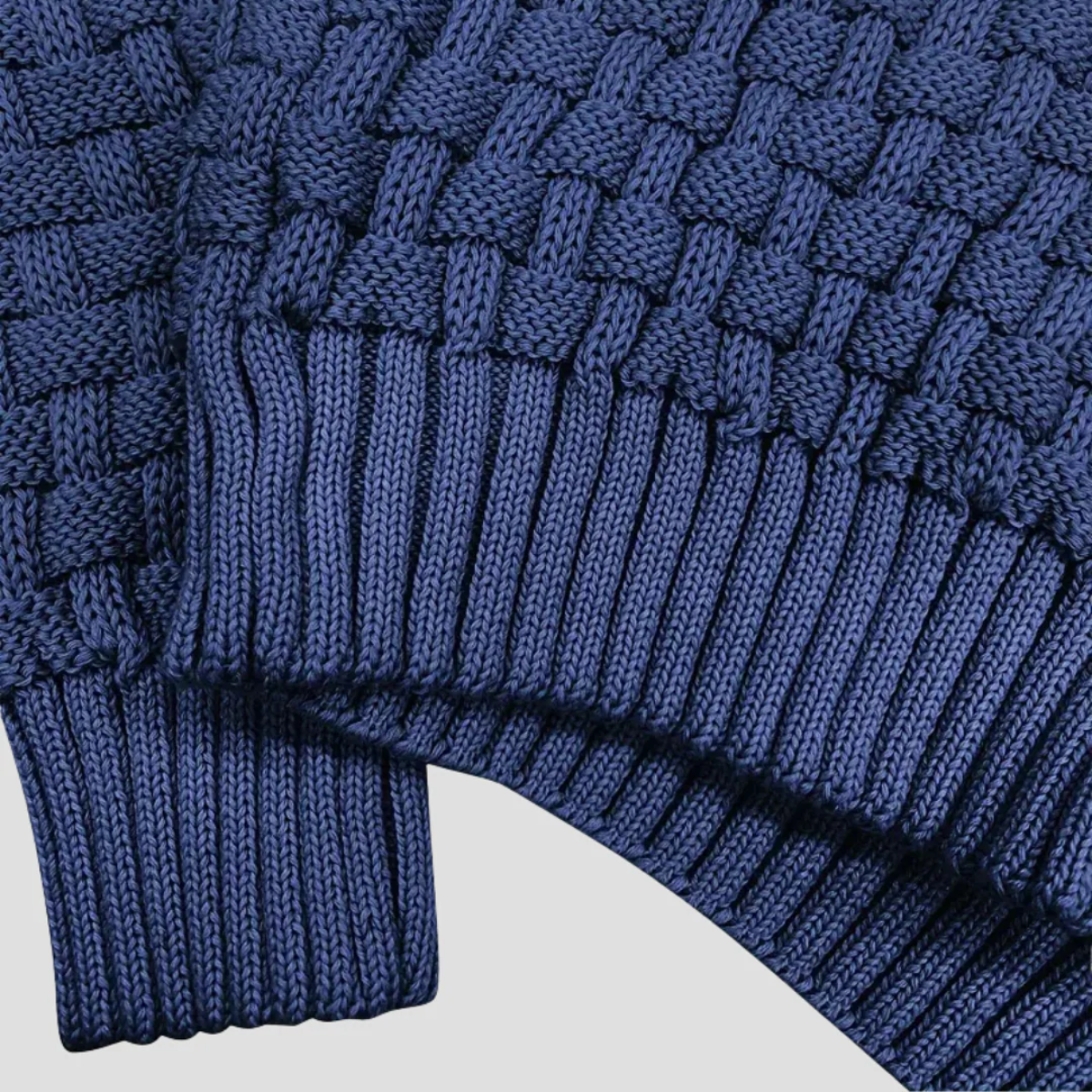 Men's blue chunky knit sweater knit texture close-up with ribbed hem and cuffs