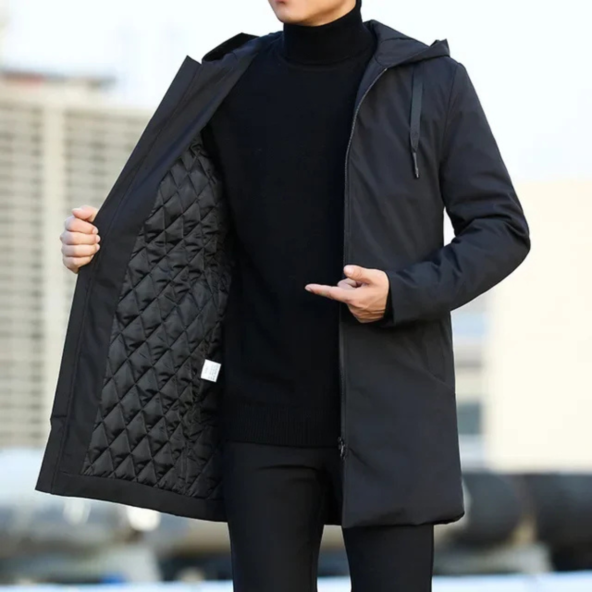 Men's long hooded rain jacket, front open to reveal quilted inner lining