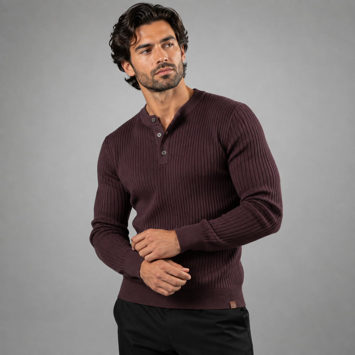 Men's brown ribbed henley knit sweater worn with buttoned neckline and long sleeves