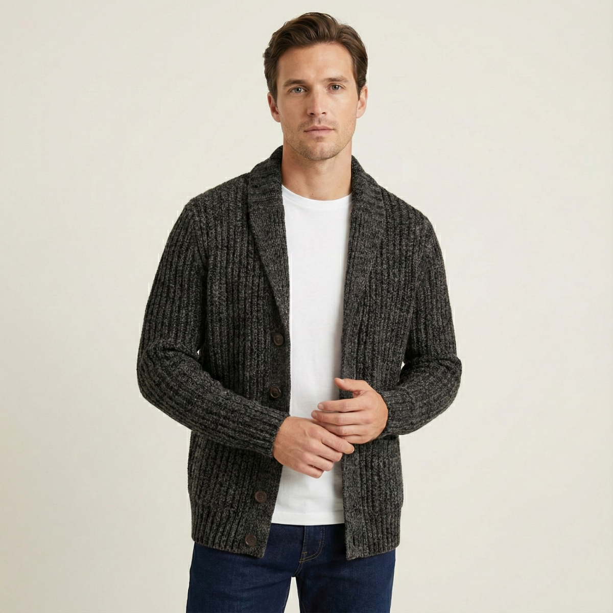 Dark gray chunky knit cardigan with shawl collar, button front, and ribbed knit texture