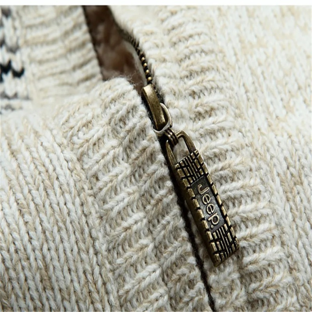 Cream knit zip-up cardigan close-up with metal zipper pull and sherpa lining