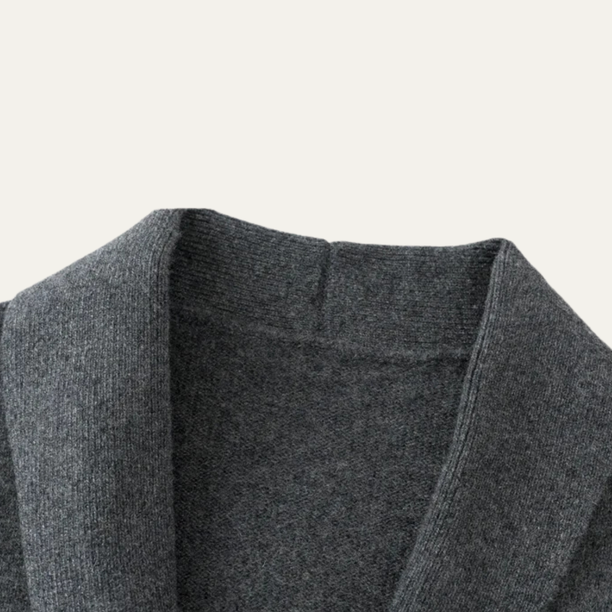Dark gray shawl-collar knit cardigan neckline and shoulder yoke