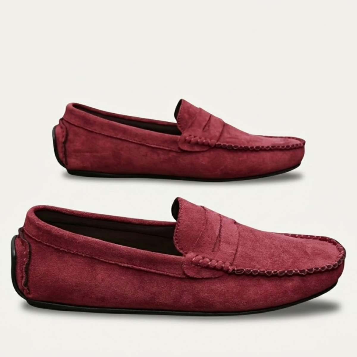 Burgundy suede moccasin loafers, slip-on style with stitched moc seams and braided trim detail.