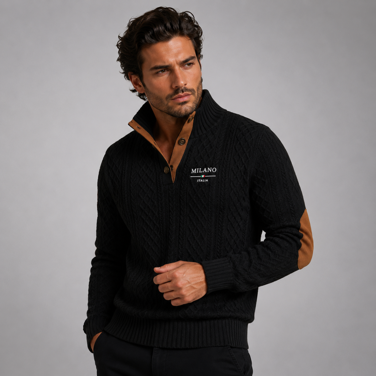 Men's quarter-zip knit sweater in black with tan elbow patches, worn with black pants
