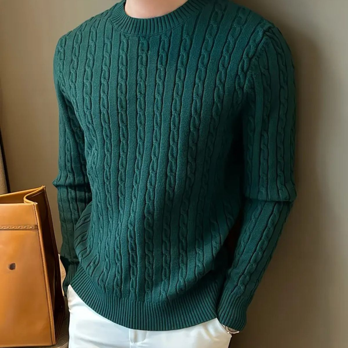 Men's green cable-knit sweater with ribbed crewneck, cuffs, and straight hem