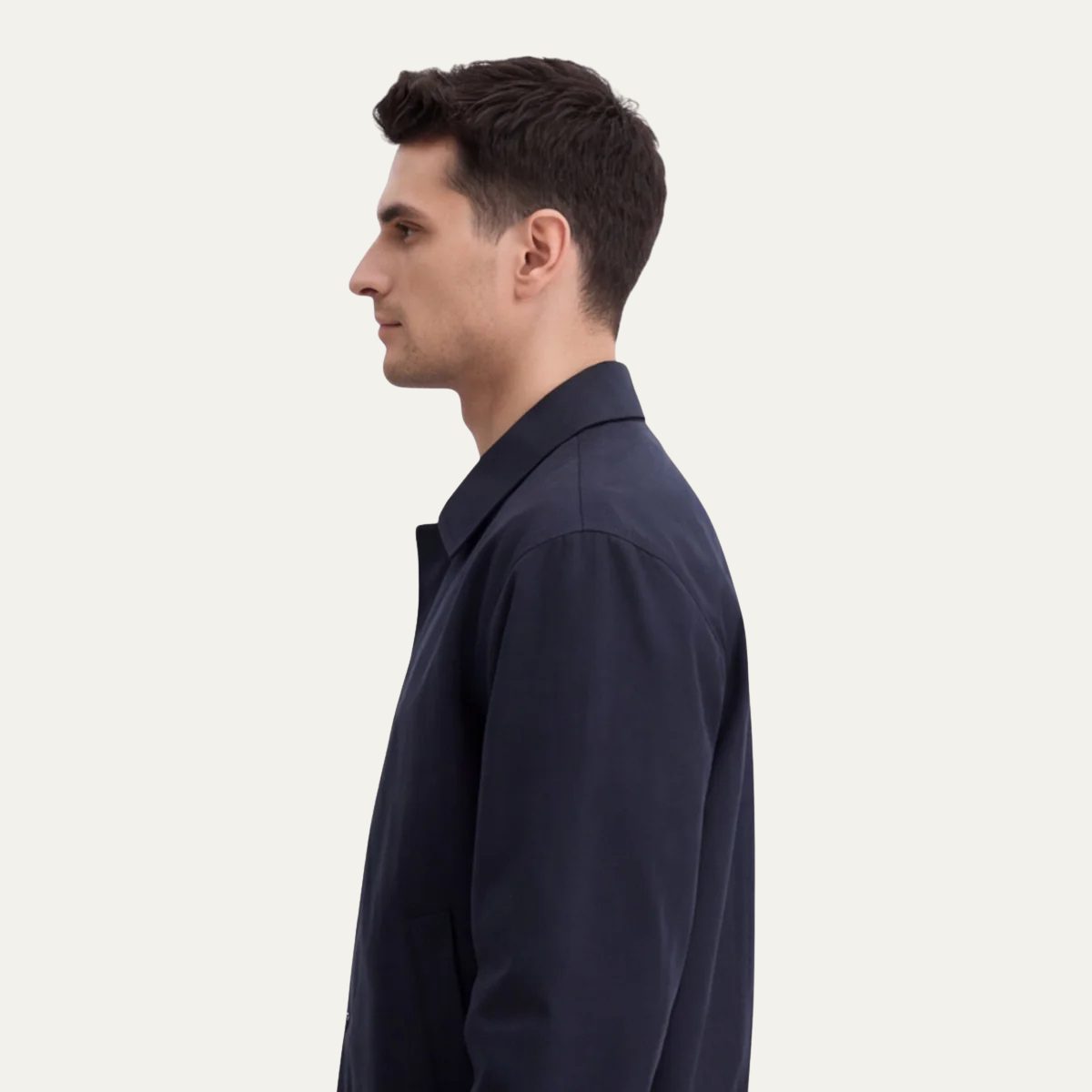 Men's navy lightweight button jacket shown in side profile with point collar