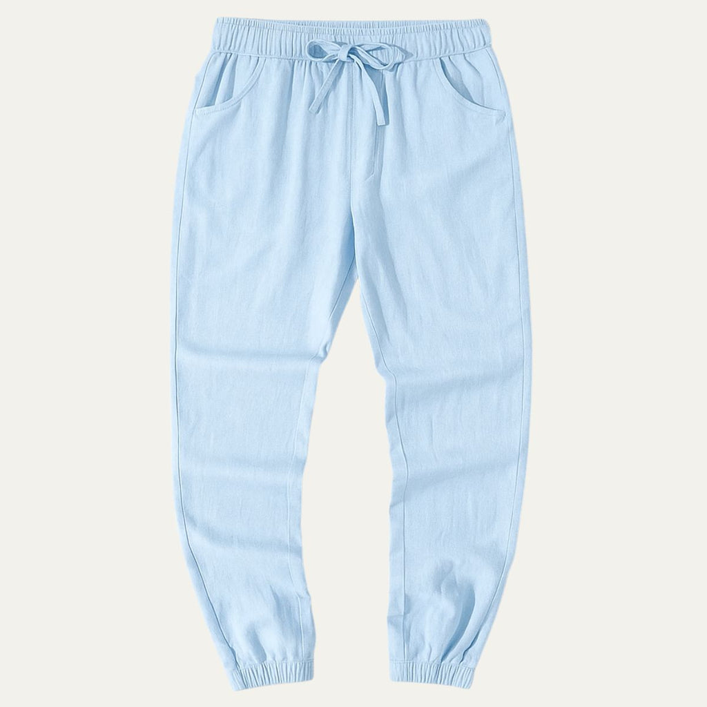 Sky blue cotton jogger pants with elastic waist, drawstring, and cuffed hems