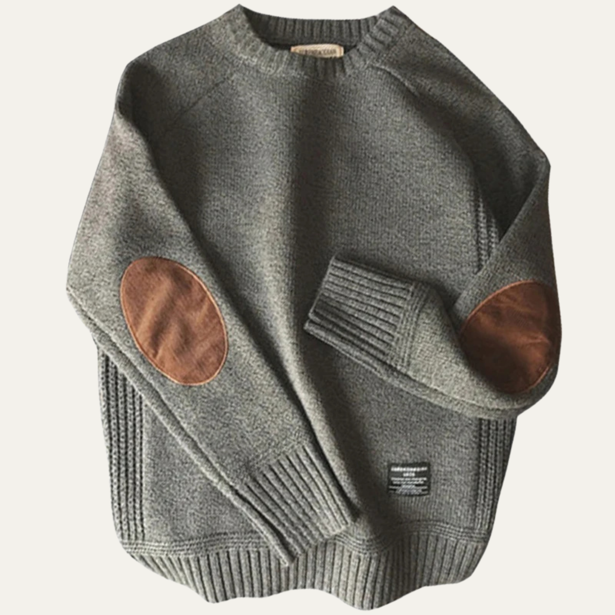 Gray knit sweater with suede elbow patches and ribbed cuffs and hem