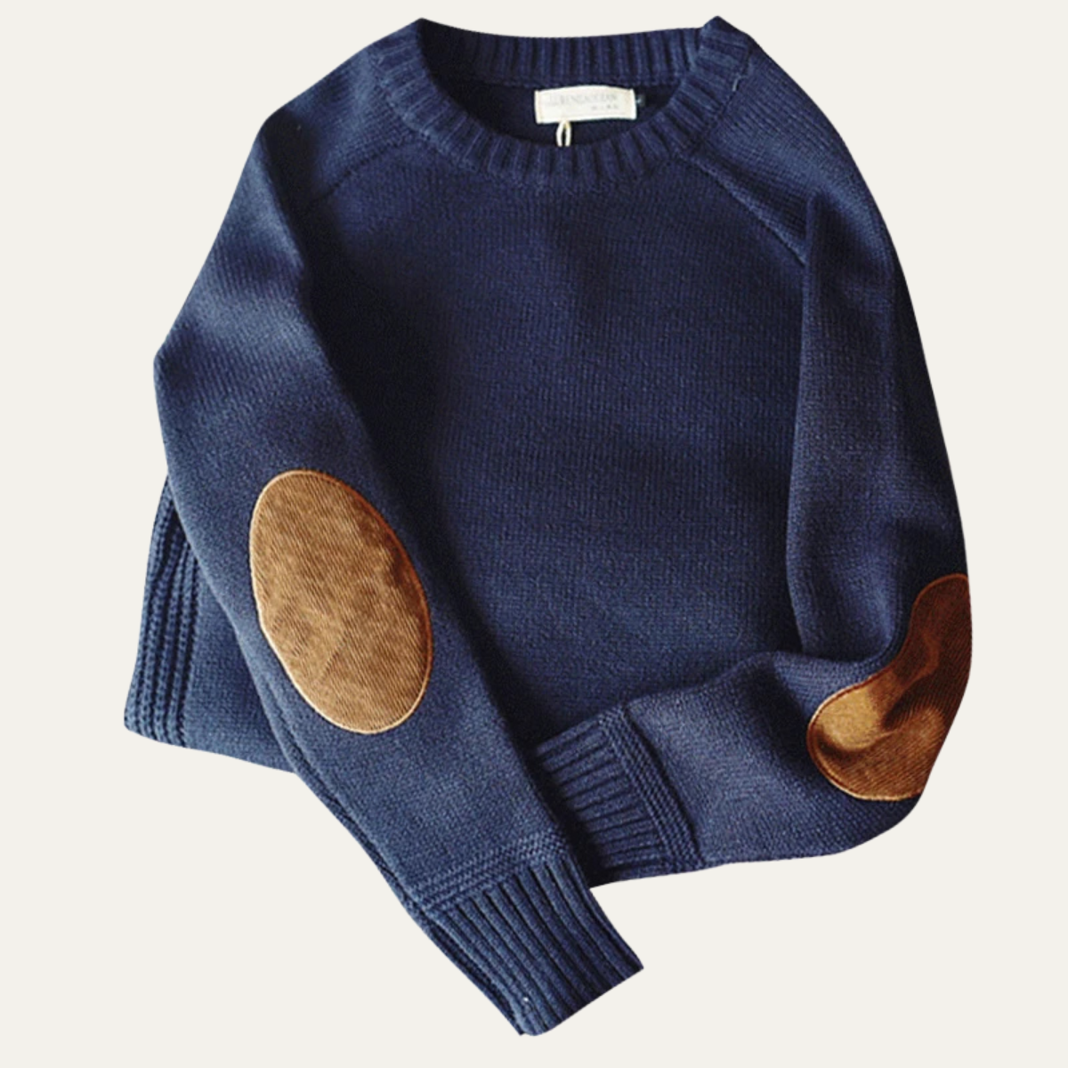Navy knit sweater with suede elbow patches and ribbed cuffs and hem