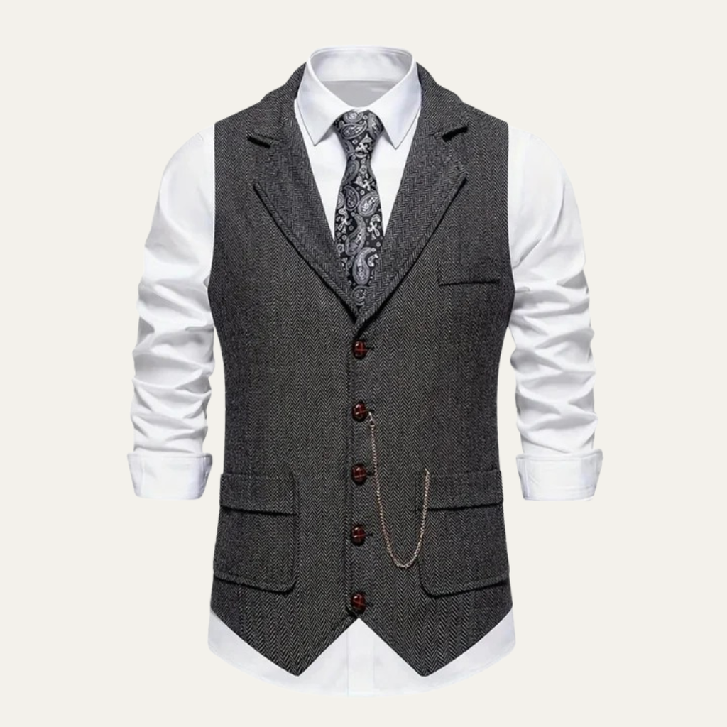 Dark gray tweed waistcoat with notch lapels, button front, and welt pockets