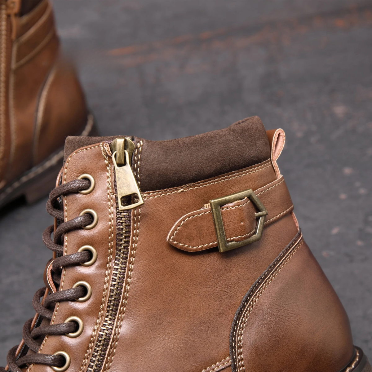 Brown ankle boot with lace-up front, side zipper, and ankle strap
