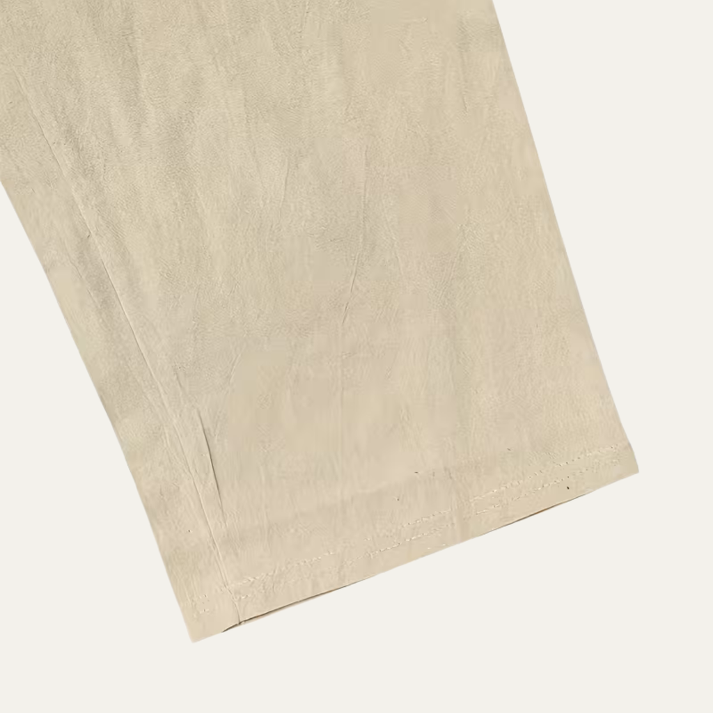 Men’s linen pants hem close-up in light beige, clean edge finish