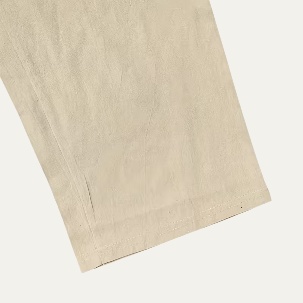 Men’s linen pants hem close-up in light beige, clean edge finish