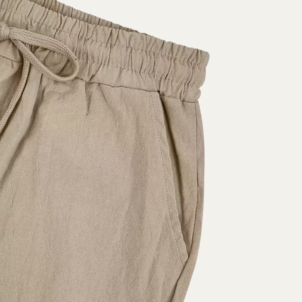 Men’s linen elastic waist pants, light beige, side view of tie and seam