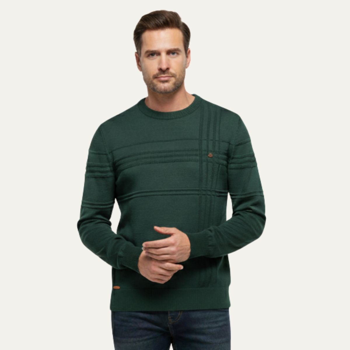 Men's dark green crew neck sweater on model, ribbed cuffs and striped front panel