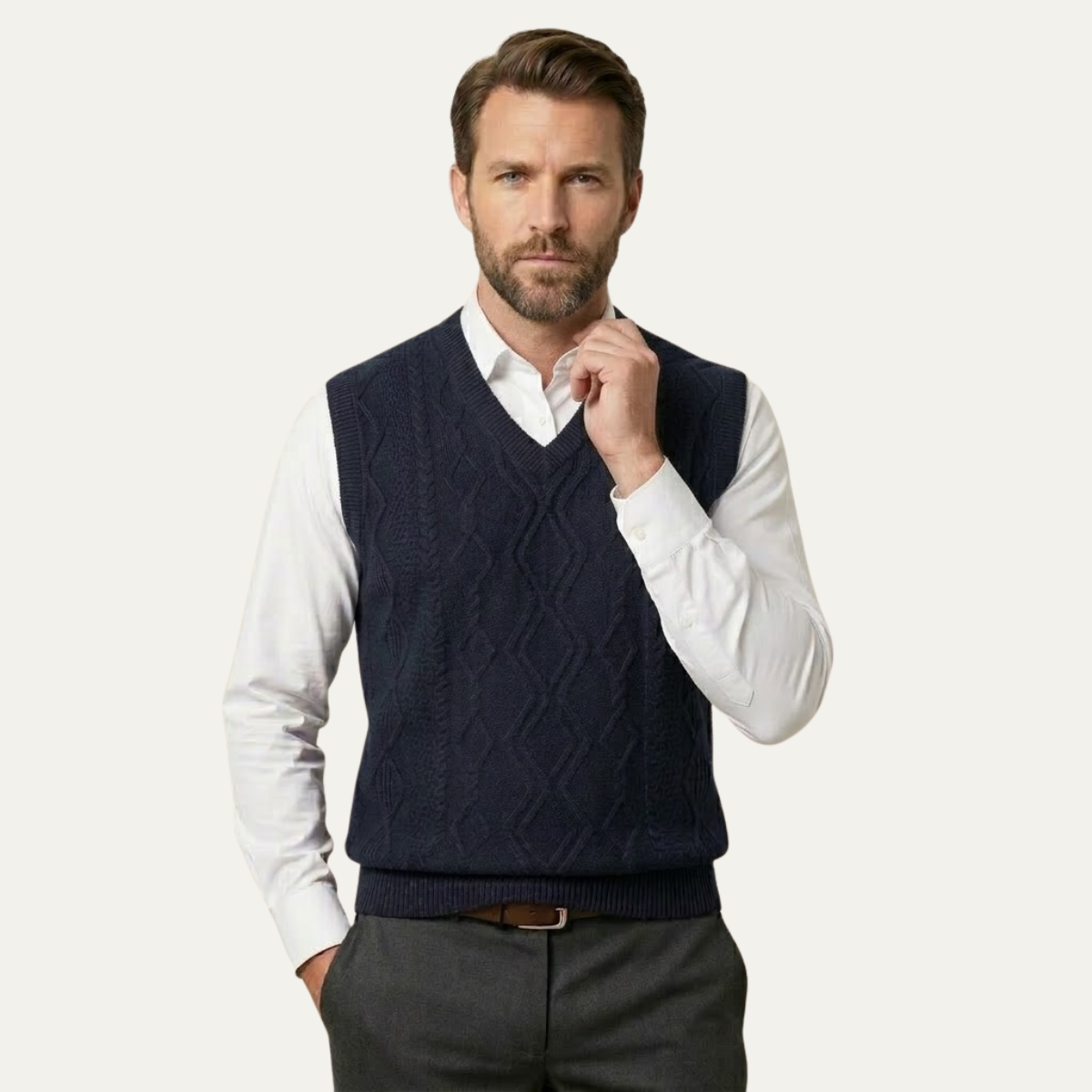 Men's navy v-neck cable knit sweater vest with ribbed bottom hem.