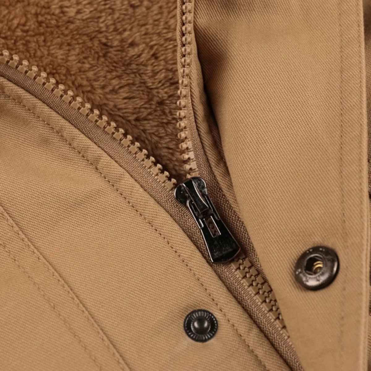 Men's khaki jacket detail: metal zipper and snap buttons with plush lining