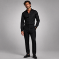 Men's slim-fit checked pants in black plaid, worn with a button waistband
