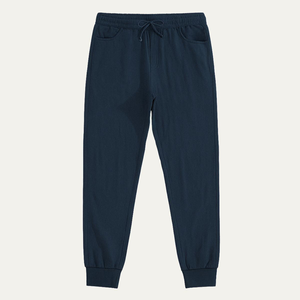 Marine blue cotton jogger pants with elastic waist, drawstring, and cuffed hems