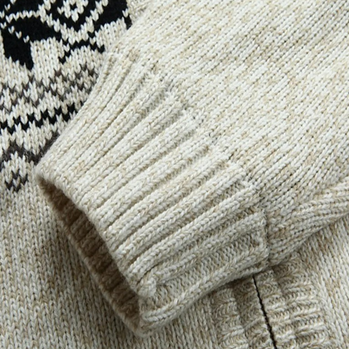 Cream knit cardigan cuff detail with ribbed sleeve edge and sherpa-lined hem