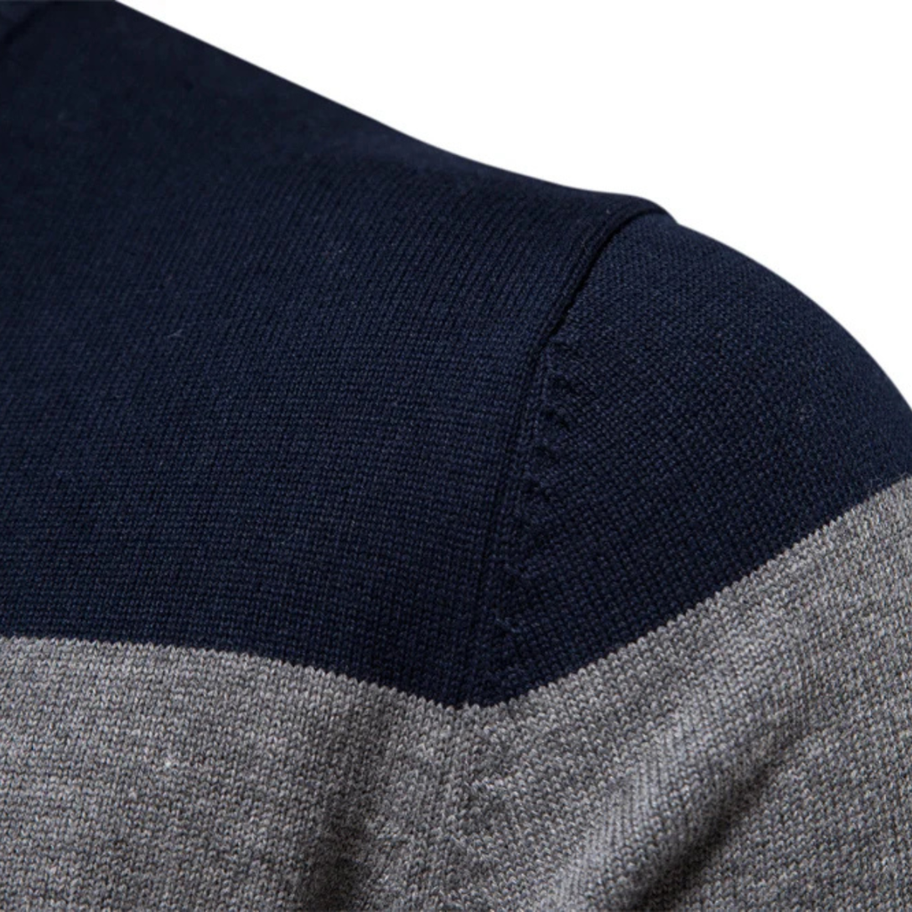 Navy knit shoulder with gray stripe and burgundy band on patchwork sweater