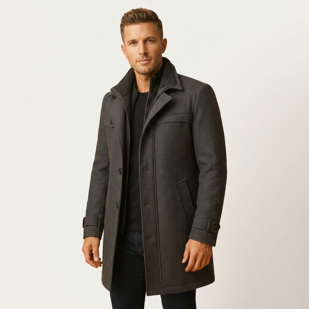 Gray wool-blend overcoat on model, high collar, front buttons, flap pockets, long sleeves