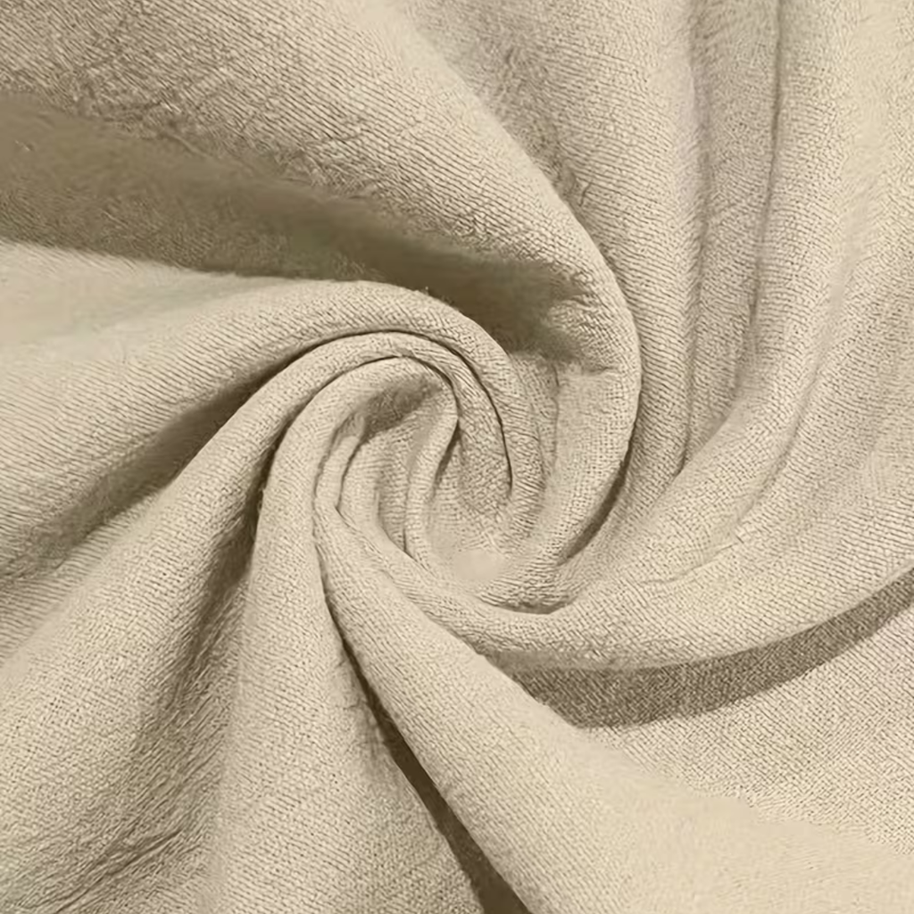 Men’s linen pants fabric close-up in light beige, textured weave detail