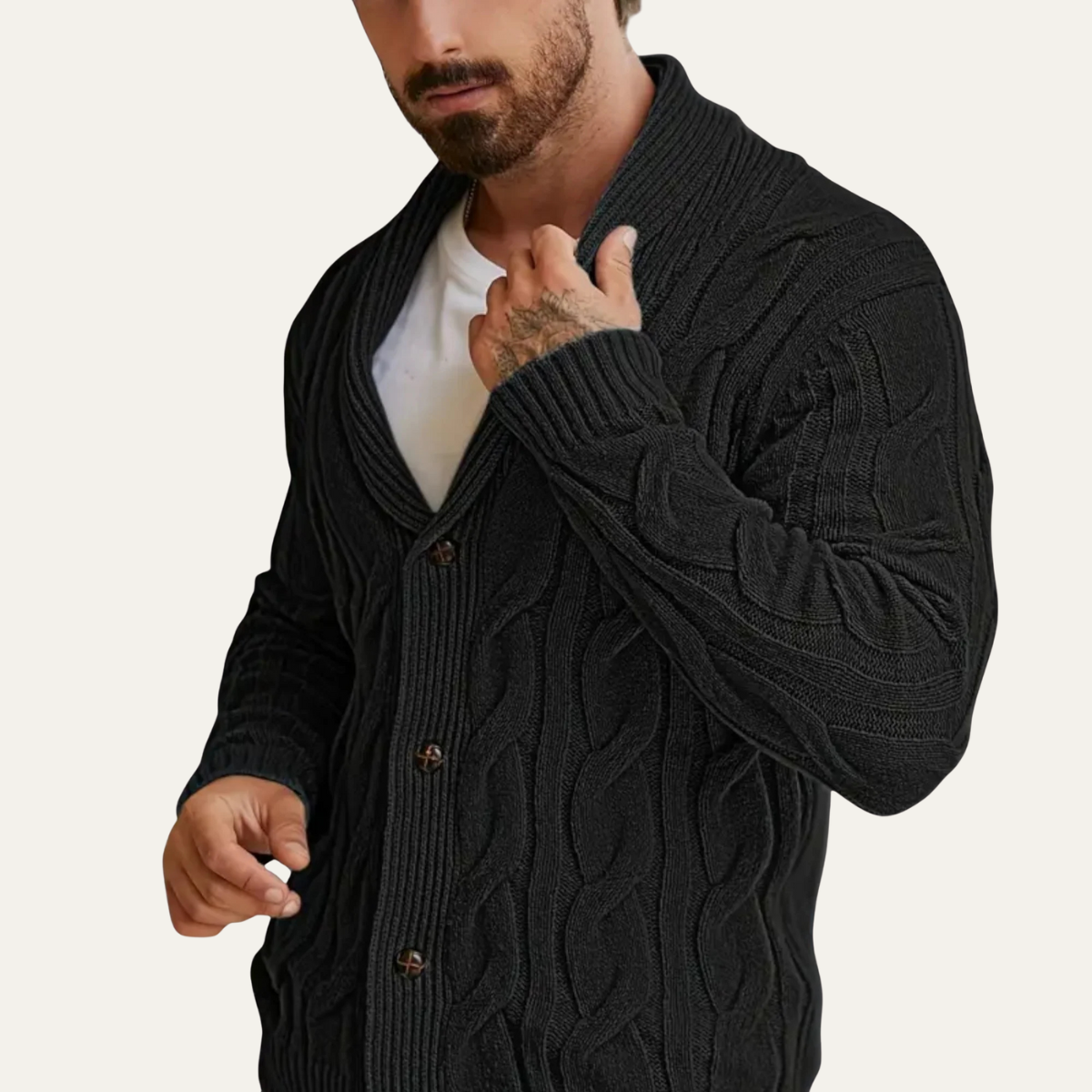 Men's black cable knit cardigan, V-neck and button front with geometric cable pattern.