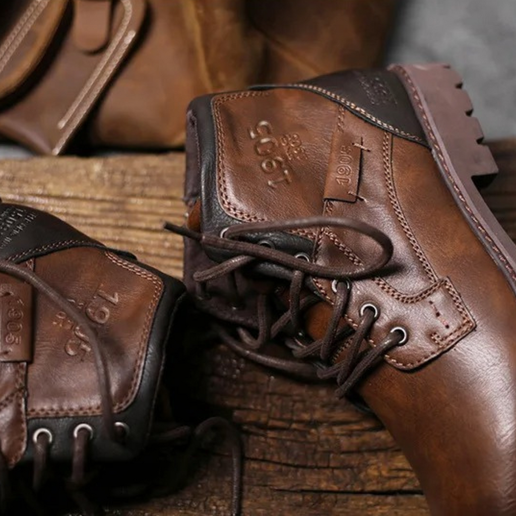 Brown leather lace-up combat boots with padded collar and rugged rubber sole