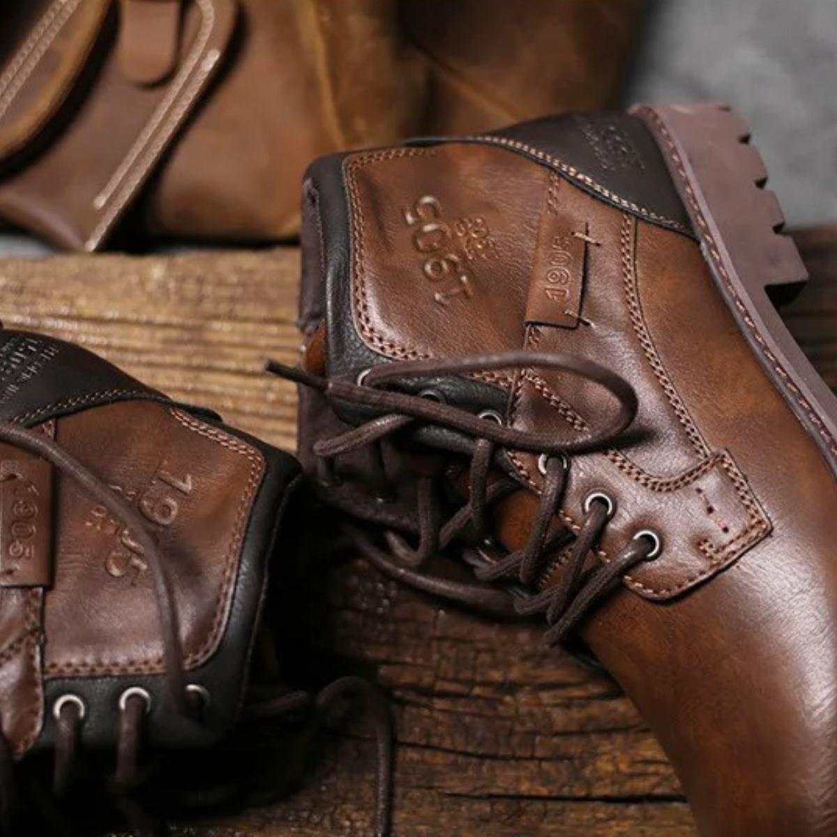 Brown leather lace-up combat boots with padded collar and rugged rubber sole