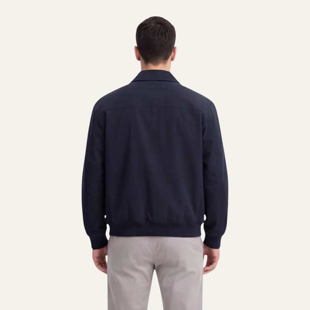 Men's navy lightweight jacket shown from back with ribbed hem and cuffs