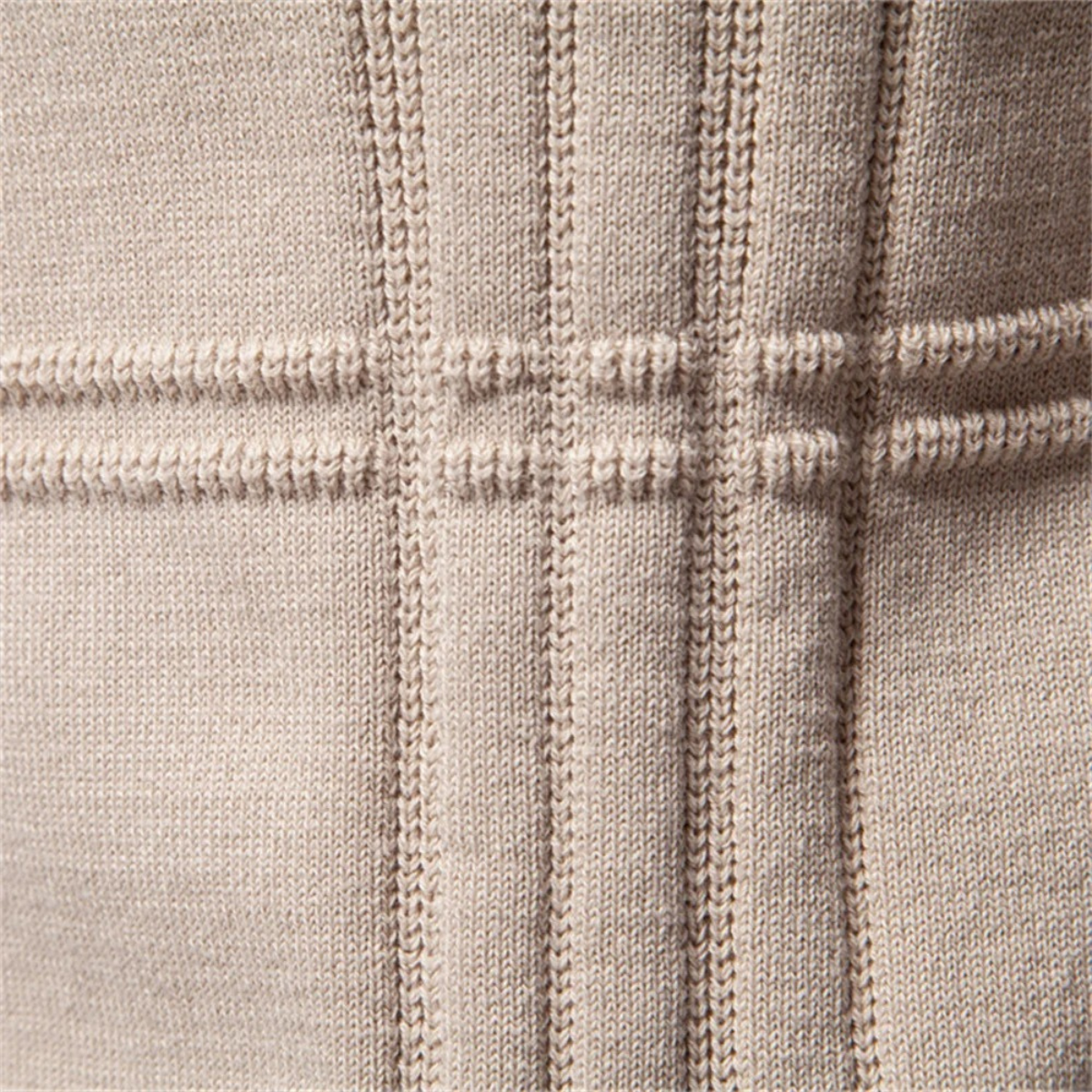Men's beige knit sweater close-up of vertical stripe and textured knit panel