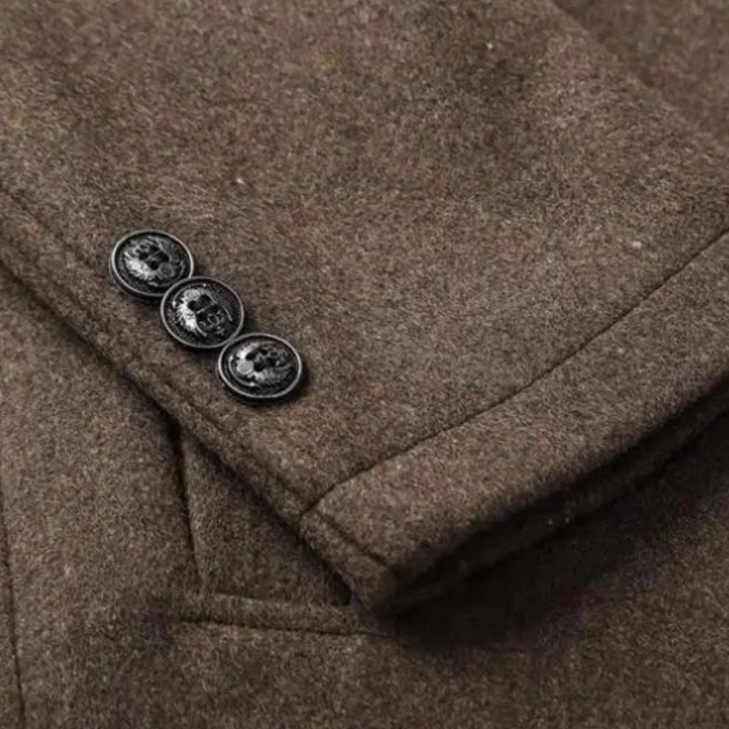 Brown wool coat close-up of stand collar with decorative button details.